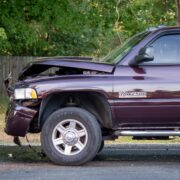 The front end of a maroon Dodge Ram pickup truck received damage after it struck another vehicle in a vehicle crash Thursday afternoon. — DN Photo | Cory Smith